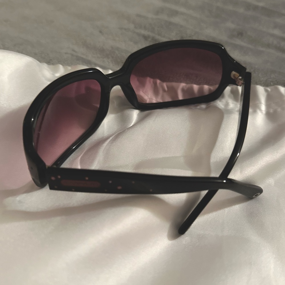 Coach sunglasses with case. Pink stone accents on sides. Like new condition.